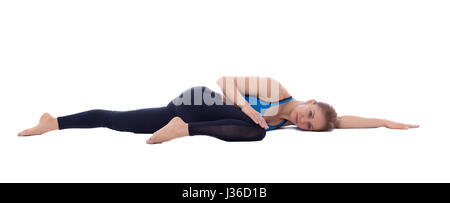 Stretching Pose mit einem professionellen Trainer ausgeführt. Stockfoto