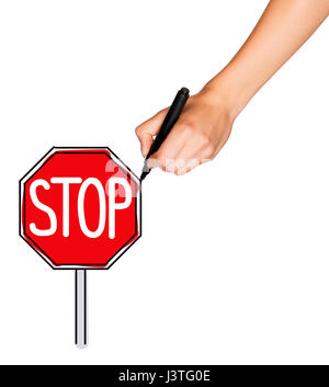 Eine weibliche Hand hält Marker und zieht Stop-Schild Stockfoto