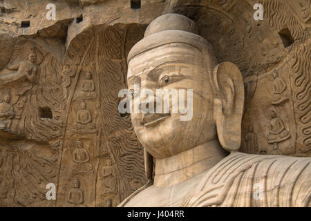 Gesicht des Buddha auf einer Klippe schnitzen an die Yungang Grotten bei Datong, Provinz Shanxi, China Stockfoto