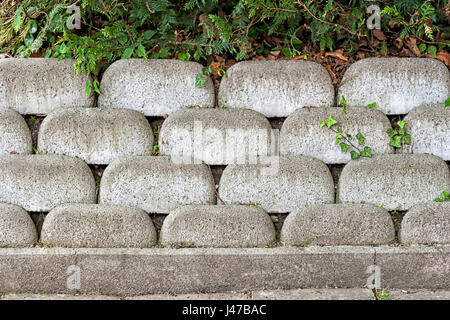 Schalung Stein Wand aus grauem Beton Ziegel Stockfoto