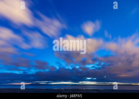 Der sonnendurchflutete Wolken über dem Wattenmeer entlang Cook Inlet, Anchorage, Alaska, USA Yunan szenische Stockfoto