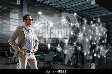 Geschäftsmann in seinem Büro. Mixed-media Stockfoto