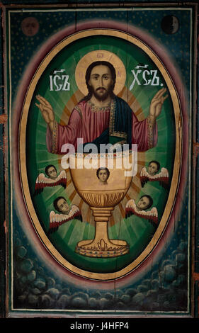 Die Ikone Jesu Christi aus dem 19. Jahrhundert in der Kirche des Heiligen Johannes des Täufers in Melnik, Bulgarien, spiegelt das reiche religiöse Erbe der Region wider. Die Kirche ist ein bedeutender Ort für die örtliche orthodoxe christliche Anbetung. Stockfoto