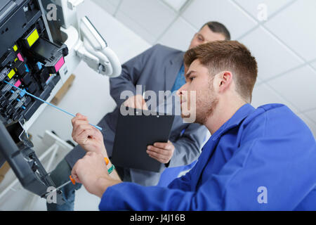 Man Service Kopierer Stockfoto