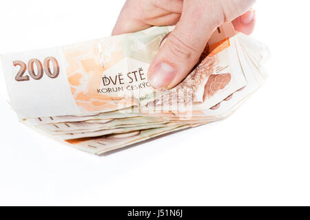 Nahaufnahme von weiblicher Hand, die tschechischen Banknoten isoliert auf weißem Hintergrund Stockfoto