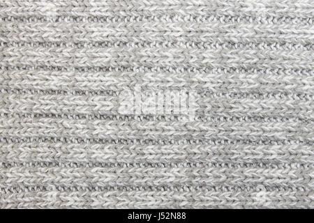 Horizontalen grauen Stoff Textilhintergrund oder Hintergrund, Strickmuster stricken. Stricken oder gestrickten Hintergrund für Design. Stockfoto