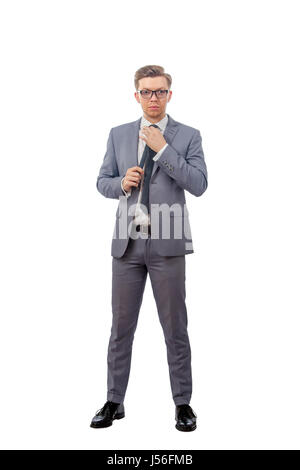 Bild von einem jungen Mann im Anzug mit Brille Stockfoto
