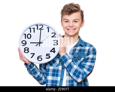 Teenboy mit grossen Uhr Stockfoto