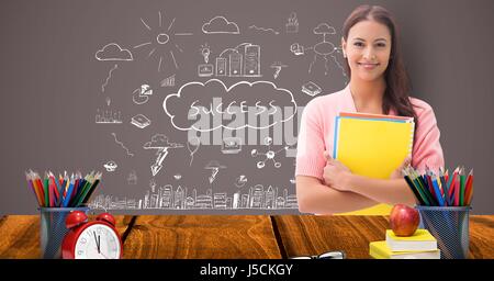 Digital Composite an Studentin am Schalter gegen Grafiken Stockfoto