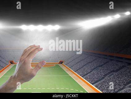 Digitalen Verbund von Hand zu berühren Luft mit Handball-Stadion Stockfoto