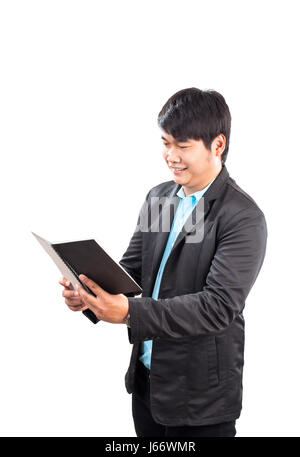 Business-Mann lesen Notizbuch mit Glück Gesicht isoliert weißen Hintergrund Stockfoto