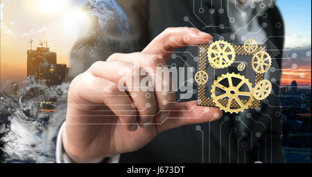 Industrie 4.0, maschinelles lernen und künstliche Intelligenz Konzept. Mann Anzug Hand mit Ai-Chipsätze und 3d Rendering Zahnräder mit Flare-Licht-Effekt Stockfoto