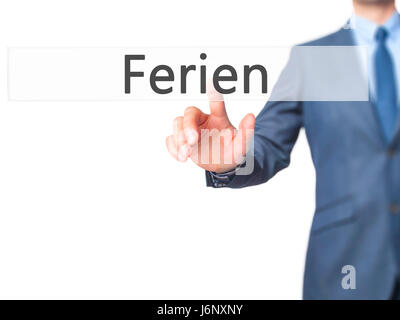 Ferien (Urlaub in deutscher Sprache) - Geschäftsmann Hand Drücken des Knopfes am Touch-Screen-Oberfläche. Wirtschaft, Technologie, Internet-Konzept. Stock Foto Stockfoto