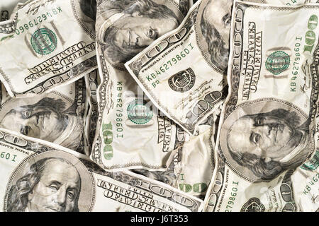 Zerknittertes Dollar befindet sich neben einander Nahaufnahme als Hintergrund Stockfoto