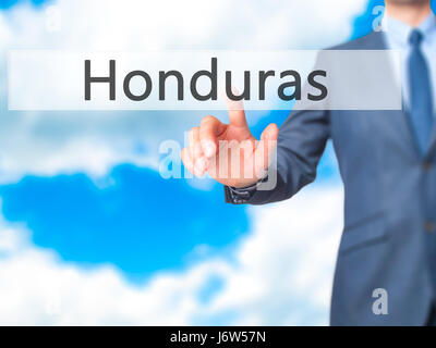 Honduras - Geschäftsmann Hand Taste am Touch-Screen-Oberfläche. Wirtschaft, Technologie, Internet-Konzept. Stock Foto Stockfoto