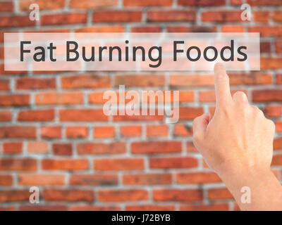 Fat Burning Foods - Hand drücken einer Taste auf unscharfen Hintergrund Konzept. Wirtschaft, Technologie, Internet-Konzept. Stock Foto Stockfoto