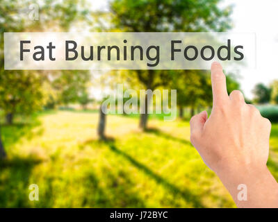 Fat Burning Foods - Hand drücken einer Taste auf unscharfen Hintergrund Konzept. Wirtschaft, Technologie, Internet-Konzept. Stock Foto Stockfoto