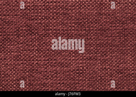 Dunkelroten gestrickte wollene Hintergrund mit einem Muster von flauschigen, weichen Tuch. Textur der kastanienbraunen Textile Closeup. Stockfoto