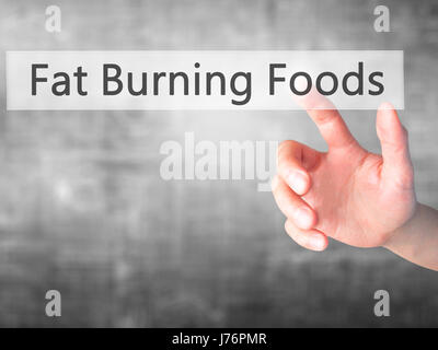 Fat Burning Foods - Hand drücken einer Taste auf unscharfen Hintergrund Konzept. Wirtschaft, Technologie, Internet-Konzept. Stock Foto Stockfoto