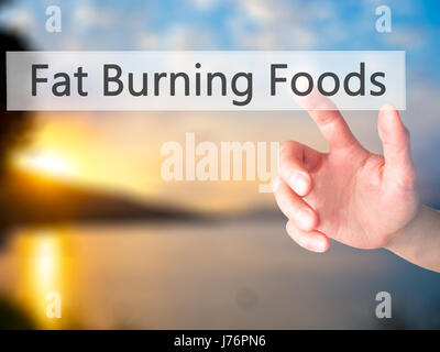 Fat Burning Foods - Hand drücken einer Taste auf unscharfen Hintergrund Konzept. Wirtschaft, Technologie, Internet-Konzept. Stock Foto Stockfoto