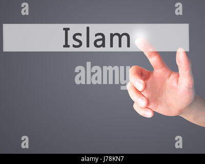 Islam - Hand drücken einer Taste auf unscharfen Hintergrund Konzept. Wirtschaft, Technologie, Internet-Konzept. Stock Foto Stockfoto