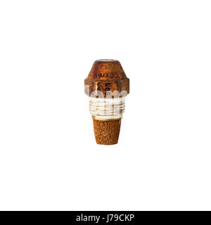 A worn out oil burner jet for an oil fired boiler on a white background Stockfoto