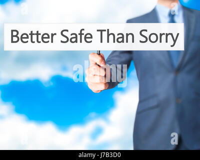 Better Safe Than Sorry - Geschäftsmann Hand mit Schild. Wirtschaft, Technologie, Internet-Konzept. Stock Foto Stockfoto