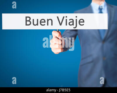 Buen Viaje (gute Reise in spanischer Sprache) - Geschäftsmann Hand mit Schild. Wirtschaft, Technologie, Internet-Konzept. Stock Foto Stockfoto