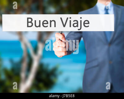 Buen Viaje (gute Reise in spanischer Sprache) - Geschäftsmann Hand mit Schild. Wirtschaft, Technologie, Internet-Konzept. Stock Foto Stockfoto