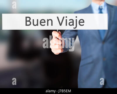 Buen Viaje (gute Reise in spanischer Sprache) - Geschäftsmann Hand mit Schild. Wirtschaft, Technologie, Internet-Konzept. Stock Foto Stockfoto