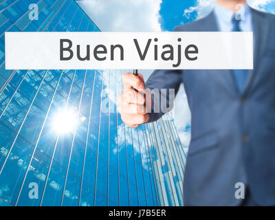 Buen Viaje (gute Reise in spanischer Sprache) - Geschäftsmann Hand mit Schild. Wirtschaft, Technologie, Internet-Konzept. Stock Foto Stockfoto