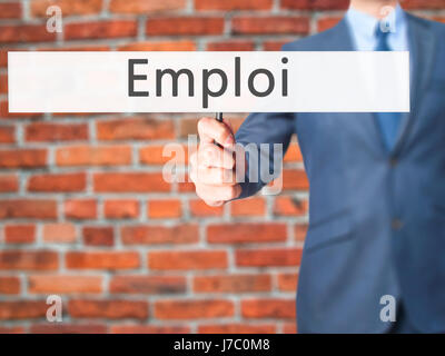 Emploi (Beschäftigung in Französisch) - Geschäftsmann Hand mit Schild. Wirtschaft, Technologie, Internet-Konzept. Stock Foto Stockfoto