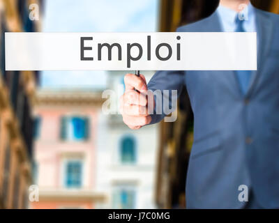 Emploi (Beschäftigung in Französisch) - Geschäftsmann Hand mit Schild. Wirtschaft, Technologie, Internet-Konzept. Stock Foto Stockfoto