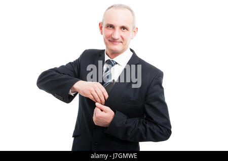 Porträt der elegante Mann, der in seiner Brieftasche Anzug isoliert auf weißem Hintergrund Stockfoto