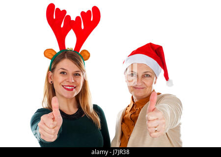 Bild von zwei glückliche Damen tragen Weihnachten Kostüme, Daumen hoch Stockfoto