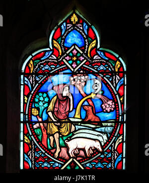 Gleichnis vom verlorenen Sohn, von Didron von Paris, 1859.  Buntglas-Fenster, Feltwell Kirche, Norfolk, England, UK.  Der verlorene Sohn ans Werk Stockfoto