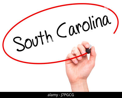 Hand des Mannes South Carolina mit schwarzem Filzstift auf Bildschirm zu schreiben. Auf Hintergrund isoliert. Wirtschaft, Technologie, Internet-Konzept. Stock Foto Stockfoto