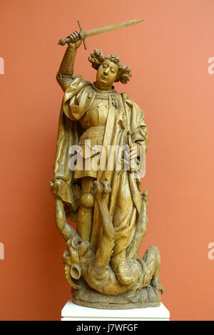 Das Gemälde „Erzengel Michael tötet den Teufel“ aus dem frühen 16. Jahrhundert zeigt den Erzengel, der über den Teufel triumphiert. Dieses um 1520 in Brabant entstandene Kunstwerk ist auf Eiche gefertigt und zeigt religiöse Ikonographie und mittelalterliche künstlerische Techniken. Stockfoto