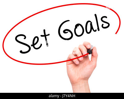 Hand des Menschen setzen Ziele auf Bildschirm zu schreiben. Geschäft, Hilfe, Internet, Technologie-Konzept. Isoliert auf weiss. Stock Foto Stockfoto