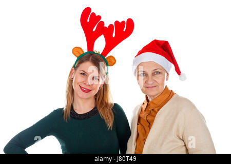 Bild von zwei weihnachtsfrauen Spaß auf einem isolierten Hintergrund Stockfoto