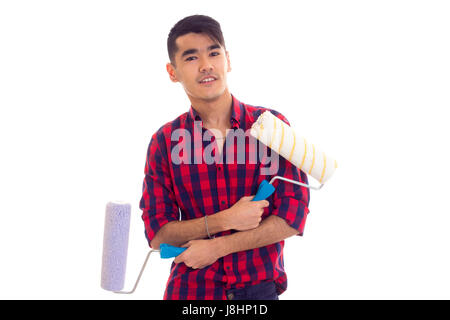 Junge Smartlooking Mann mit dunklen Haaren Rot kariertes Hemd mit farbigen rollt auf weißem Hintergrund im studio Stockfoto