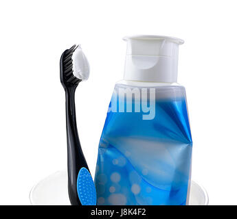 Zahnpasta und Zahnbürste im Glas Stockfoto