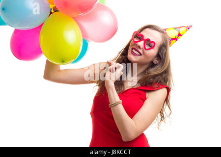 Junge Frau Holding Ballons Stockfoto