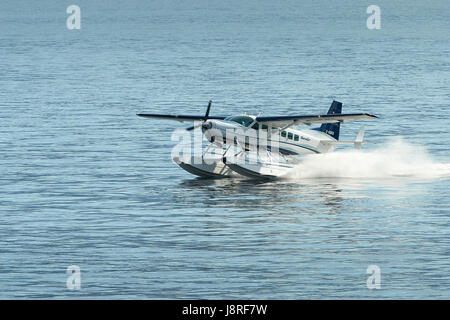 Seair Wasserflugzeuge Cessna 208 Caravan Wasserflugzeug landet auf dem Vancouver Harbour Flight Centre, Britisch-Kolumbien, Kanada. Stockfoto