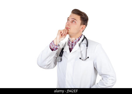 Bild von einem gutaussehenden jungen Arzt über die Behandlung denken Stockfoto