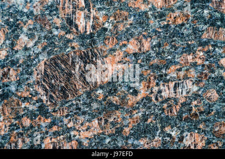 Granittextur, rot mit schwarzen und grauen Flecken Stockfoto