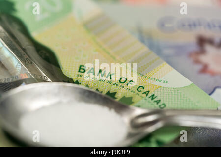 Sterling und Euro-Banknoten und-Münzen Stockfoto