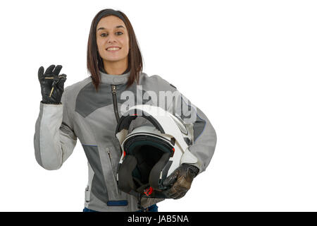 Glückliche junge Frau zeigt stolz ihre neue Motorrad-Führerschein auf weiß Stockfoto