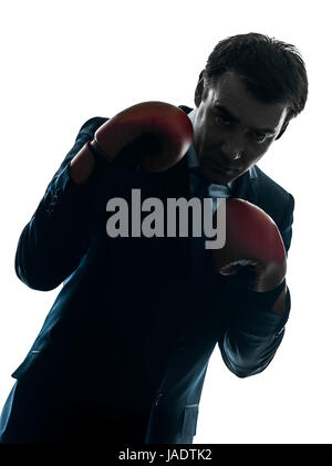 ein kaukasischer Geschäftsmann mit Boxhandschuhen Silhouette Studio isoliert auf weißem Hintergrund Stockfoto