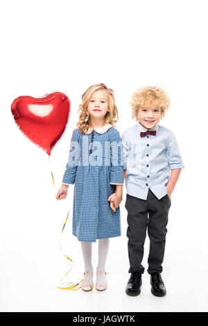 Kinder mit geformten Herzballon Stockfoto